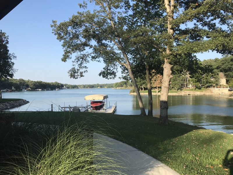 Summer dock with boat lift and red boat at Lake Panorama