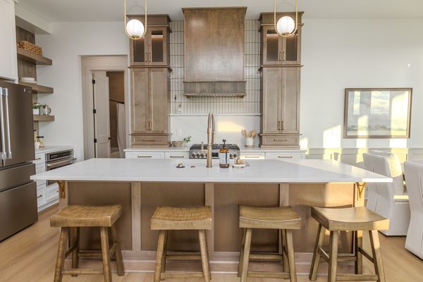 Kitchen with custom range hood