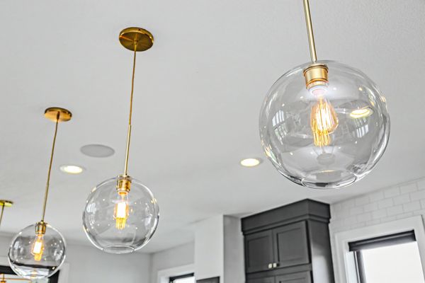 Glass pendant lights over the island
