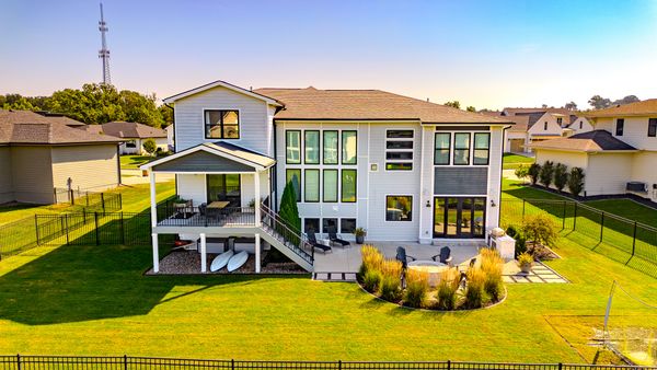 Rear exterior with covered deck and patio